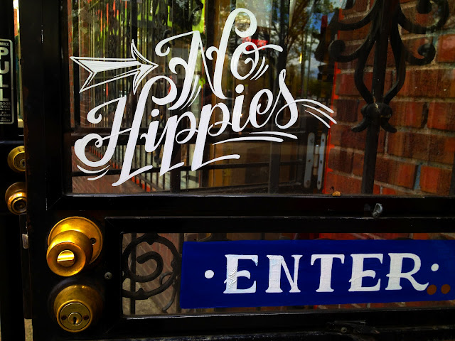 A door in the lower Highlands neighborhood near downtown Denver that says, "No HIppies".