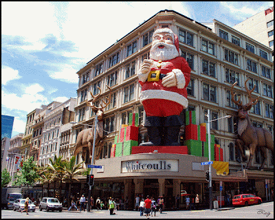 Very large Santa on Queen Street building in downtown Auckland