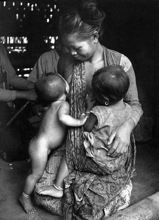 Women+breastfeeding+animals