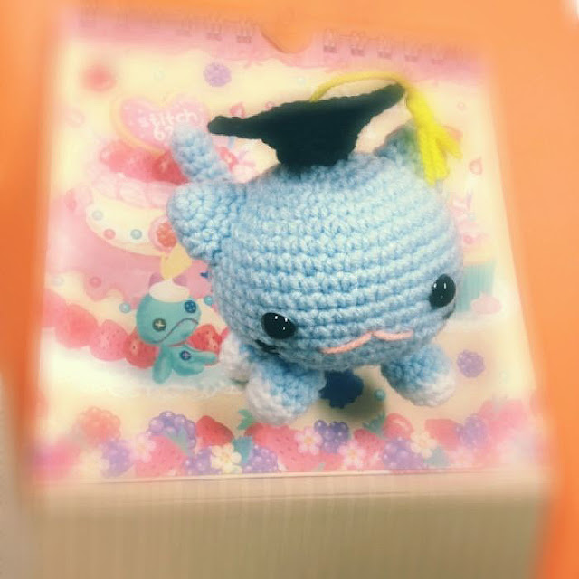 crocheted roly poly cat with graduation hat amigurumi