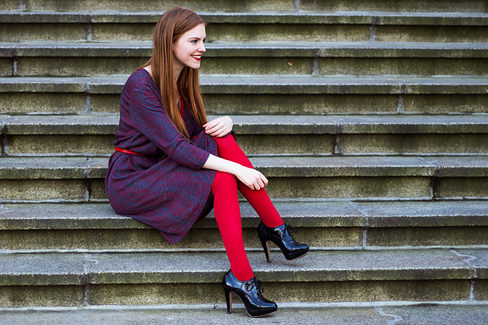 Retro style fashion blogger outfit with red tights and button up dress