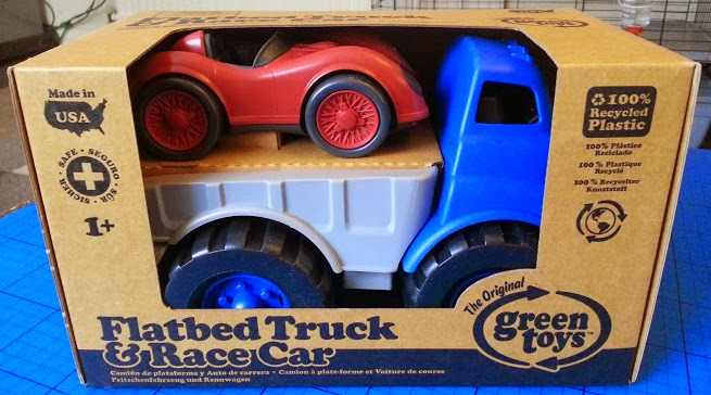 green toys flatbed truck and race car
