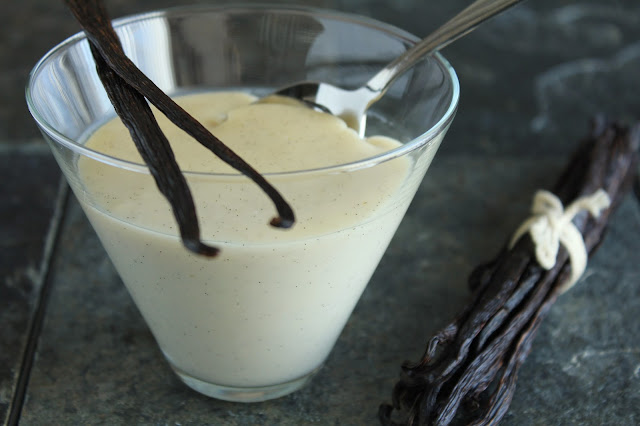 vanilla bean pudding in martini glass with spoon