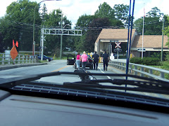 Girls pushing their car into New Brunswick.