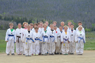Martial Arts Kids Posing in Taekwondo Unforms Martial arts kids in their Taekwondo unforms