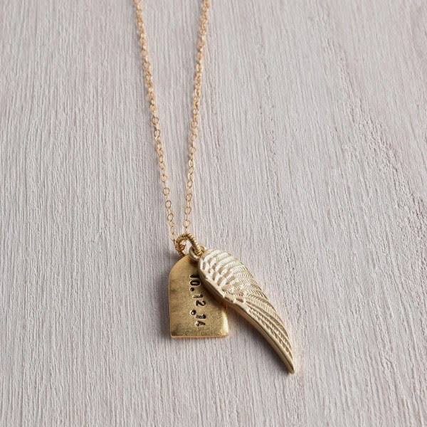 http://www.whitetrufflestudio.com/collections/new-arrivals/products/white-truffle-personalized-tag-and-gilded-wing-necklace