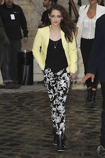 Kristen Stewart in leather jacket and floral print pants
