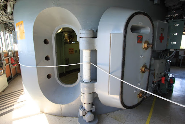 Look at 17-inch thickness of the armored steel door of the cockpit to prevent from the missile attack at Battleship USS IOWA BB61 in Los Angeles, California, USA Look at 17-inch thickness of the armored steel door of the cockpit to prevent from the missile attack at Battleship USS IOWA BB61 in Los Angeles, California, USA