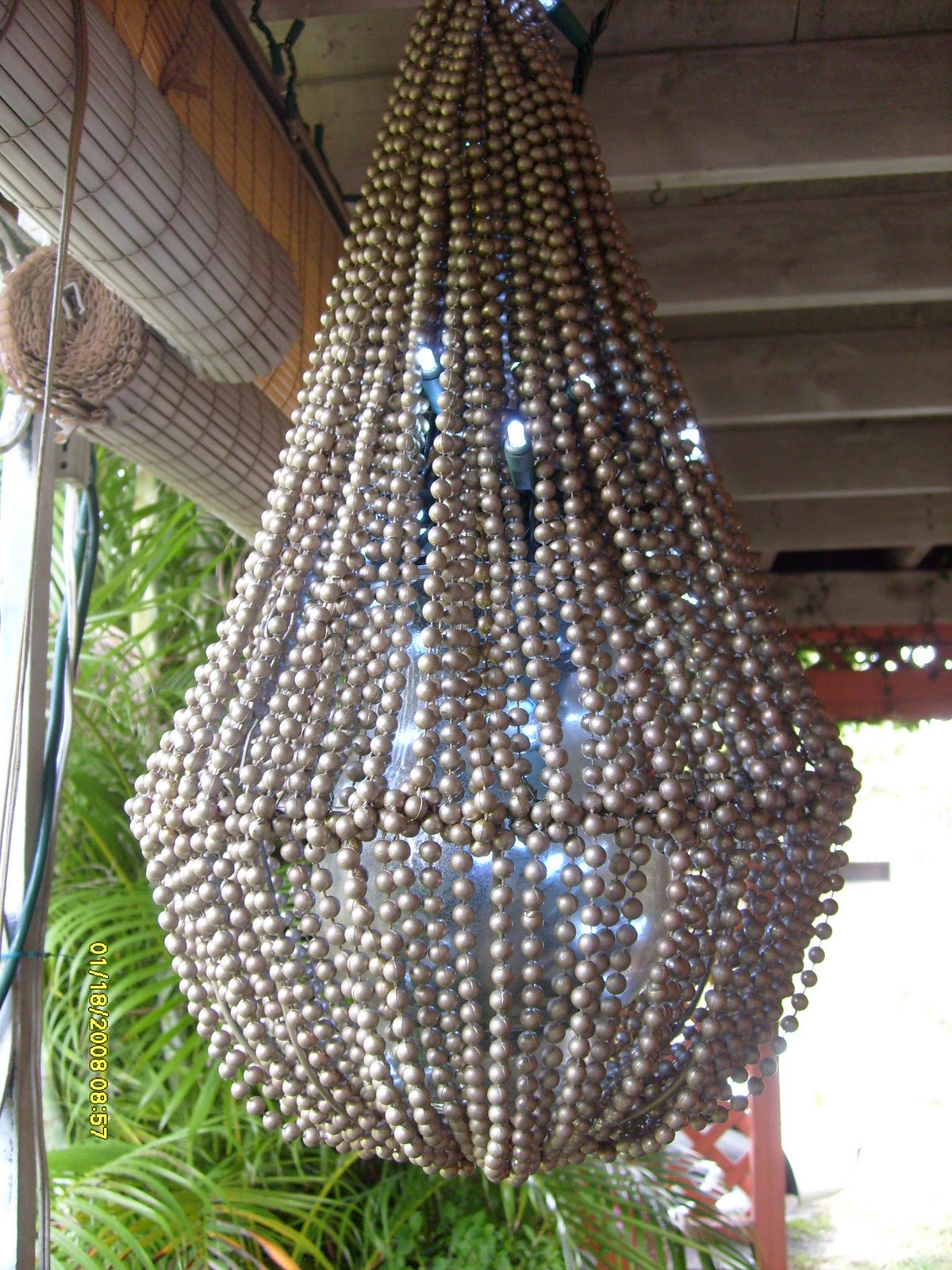 The beaded chandelier in the daylight. You can barely make out the title=