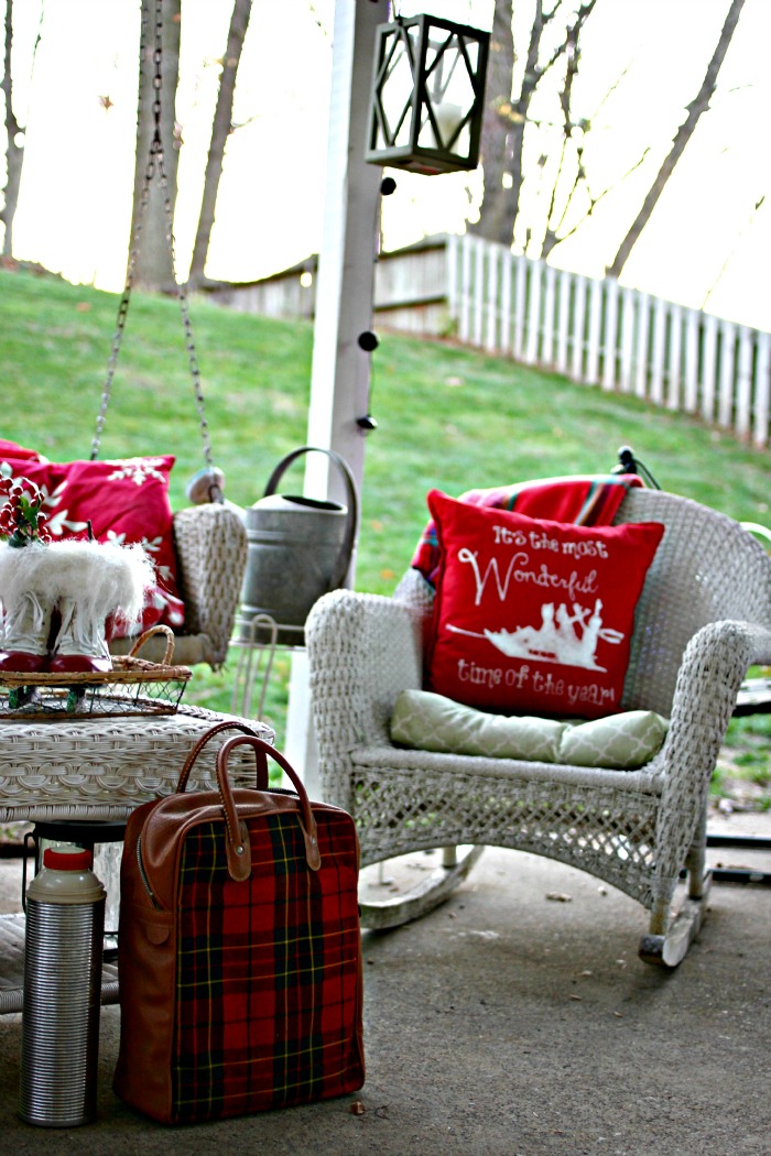 Outdoor covered patio decorated for Christmas with red and white - www.goldenboysandme.com
