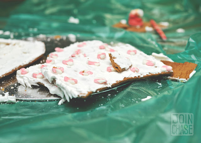 A smashed gingerbread house on top of a green plastic garbage bag in Yangon, Myanmar.