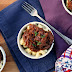 Oxtail Ragú over 4-Cheese Macaroni