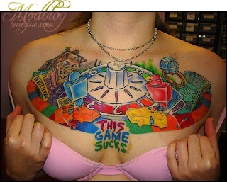 Tattooed Women with Video Games Tattoo Design on Chest