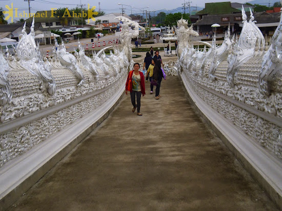 Visitors to Wat Rong Khun, Chiang Rai, North Thailand