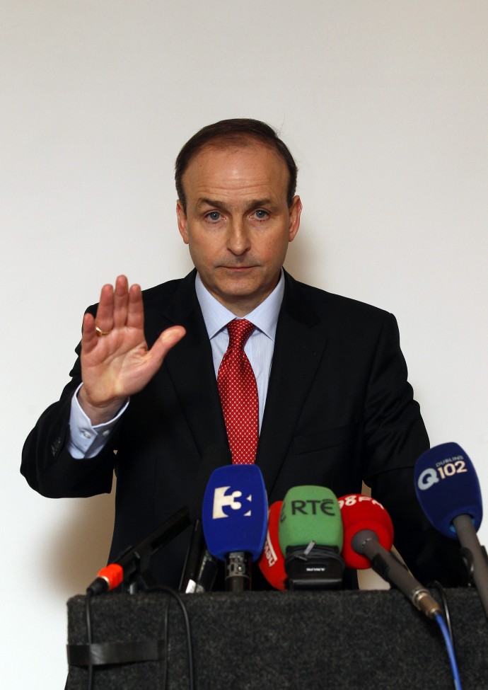 61118-irelands-foreign-minister-martin-gestures-during-a-news-conf.jpg