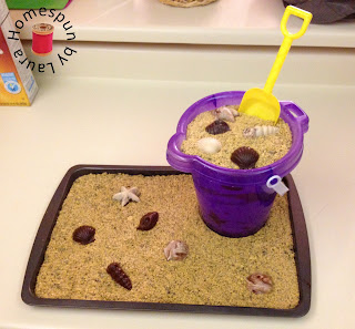 beach cake with sand bucket