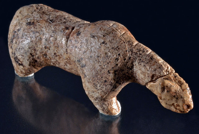 Lion or possibly Bear figurine carved from mammoth ivory - found at Vogelherd Cave in Germany. Approx 40.000 years BP, from upper paleolitic age
