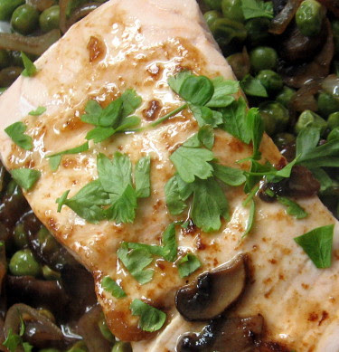 poached salmon with peas and mushrooms