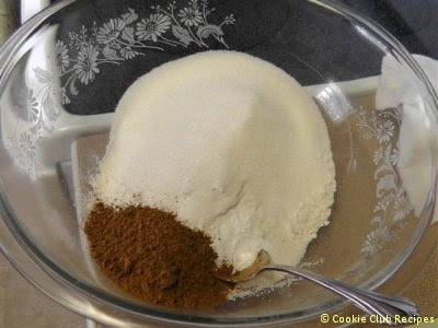 flour, sugar, salt, soda, and cocoa in bowl