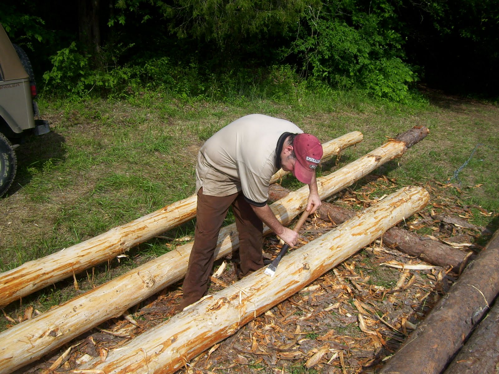 Building A Butt And Pass Log Cabin Peeling Some Racked Logs Finally