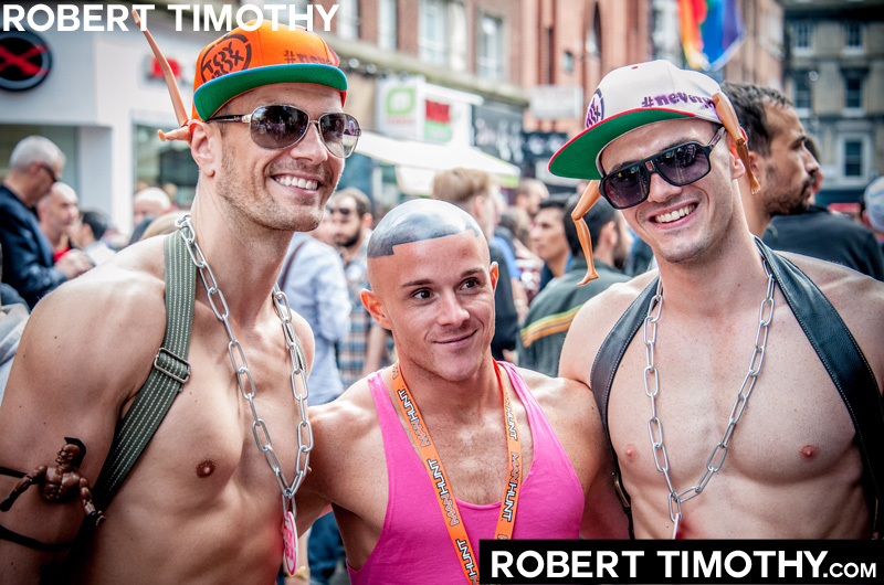 Three guys on Old Compton Street in London during 2012 World Gay Pride celebrations