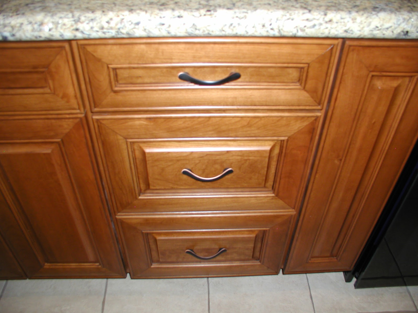 Kitchen cabinet trash can pull out in the base cabirather than in the wall cabinet