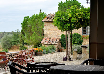 View of the Terrace at Borgo Argenina from the Breakfast Room - Gaiole in Chianti, Italy | Taste As You Go