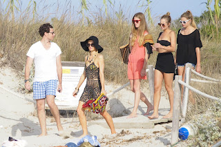 Paris Hiltonwith friends in a beach