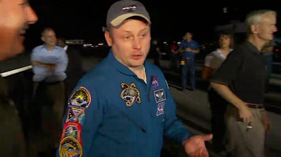 Mission Specialist Mike Fincke, who clocked 382 days in space making him the record-holder American astronaut, talking to the team on the ground as the astronauts walk around Endeavour. NASA 2011.