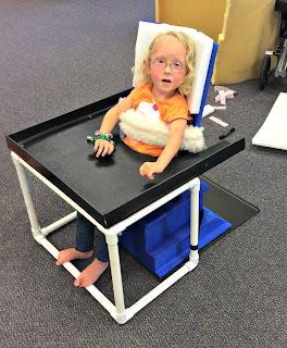 4-year-old Emma in her new chair.