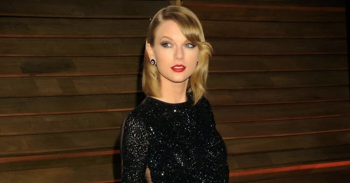 Taylor Swift in a sequinned Julien Macdonald gown at the 2014 Vanity