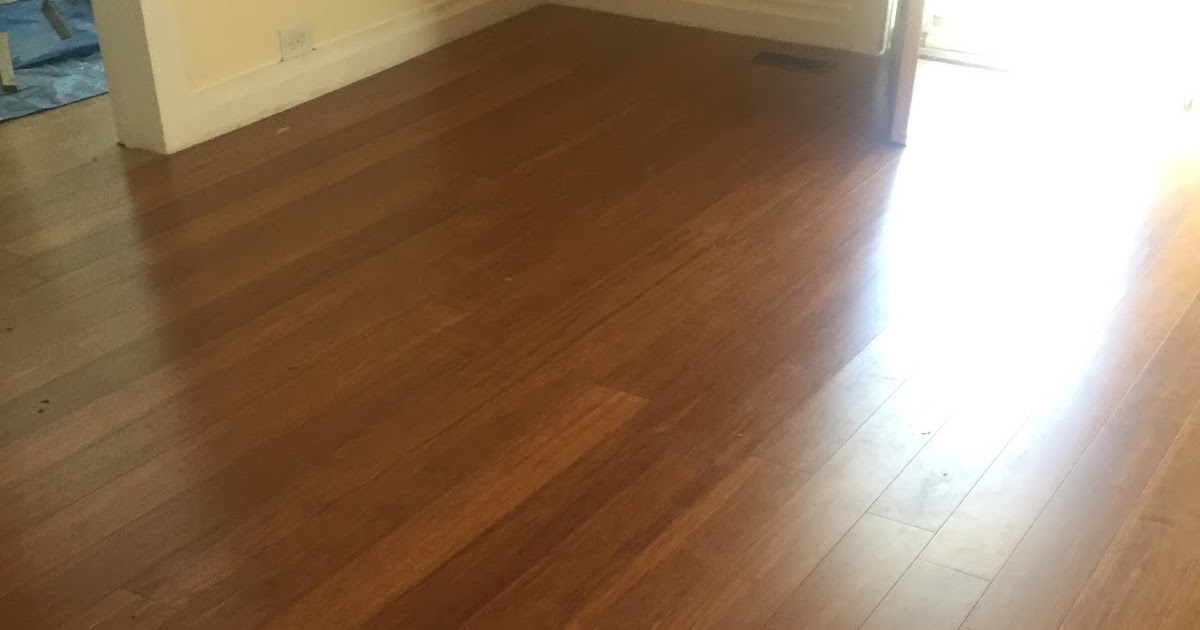 Breaking Up With New York Smoothing white paint on the uneven baseboards