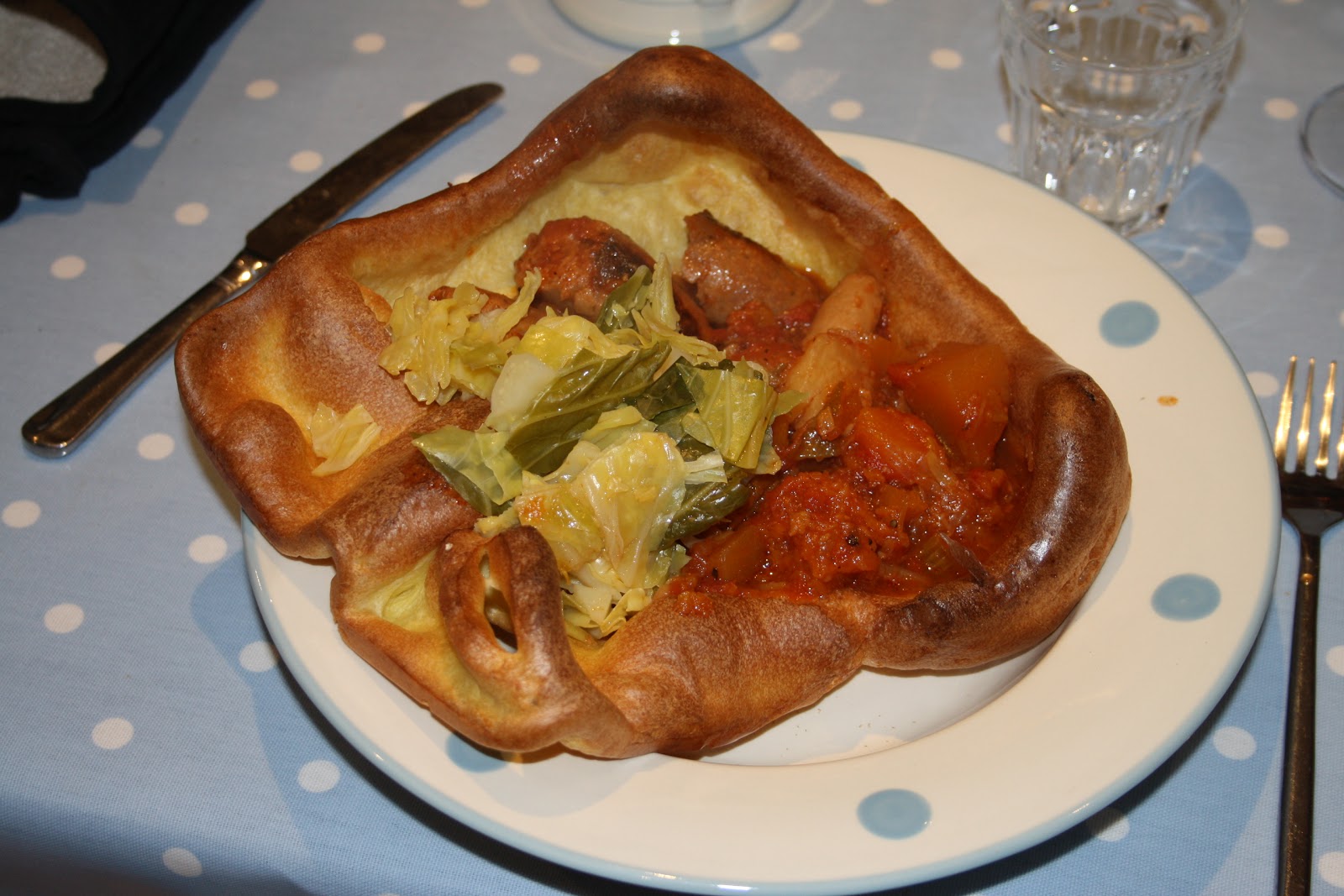 Kitchen Fairies Sausage casserole in giant yorkshire pudding