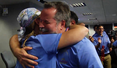Curiosity MSL lands on Mars. Entry, Descent and Landing (EDL) team in blue shirts. emotional embraces. 6 August 2012. NASA/JPL.