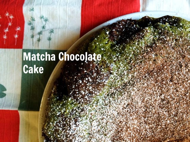 Detail of matcha chocolate cake dusted in cocoa powder and powdered sugar