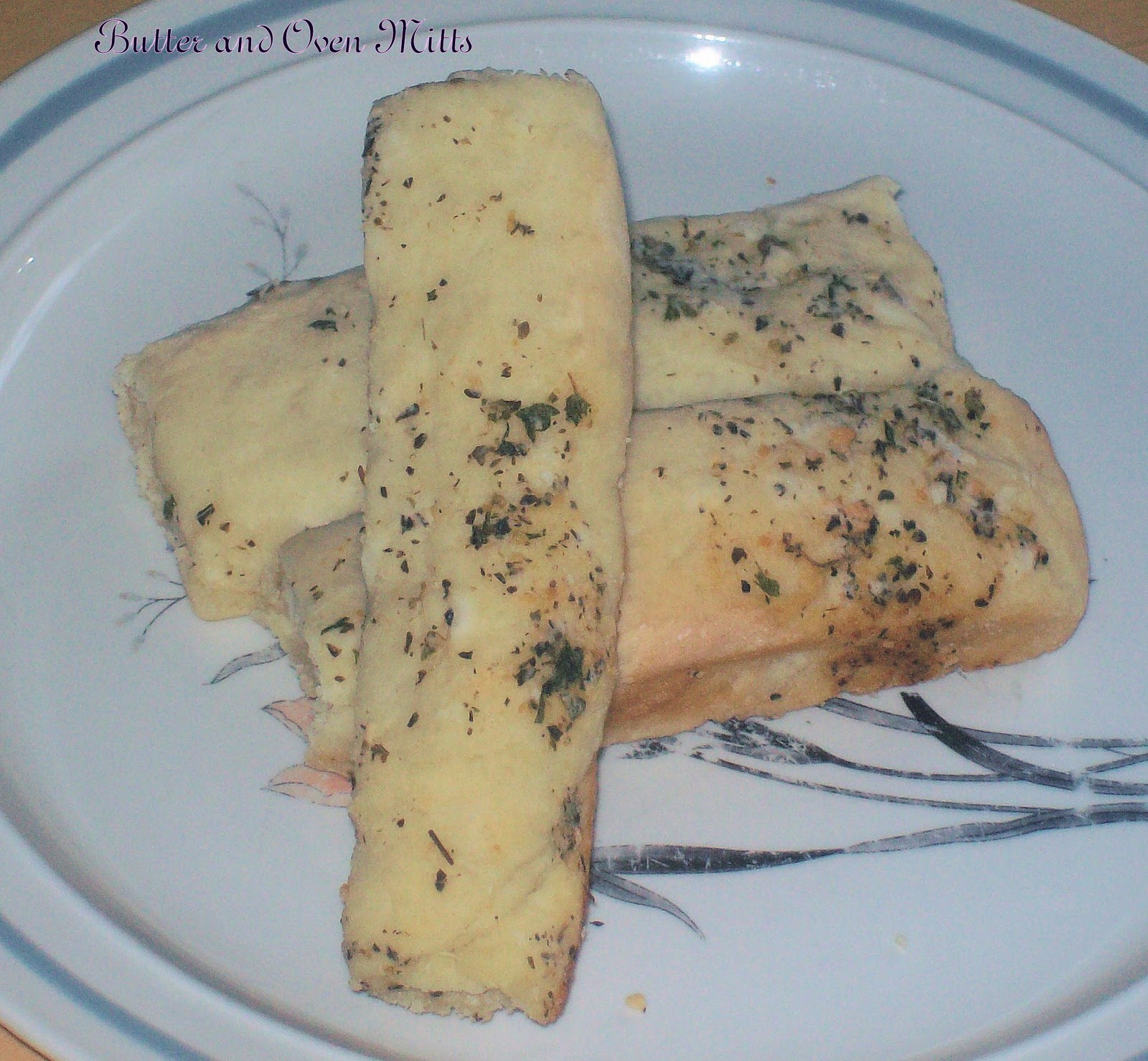 Butter and Oven Mitts Garlic Breadsticks and Homemade Garlic Bread