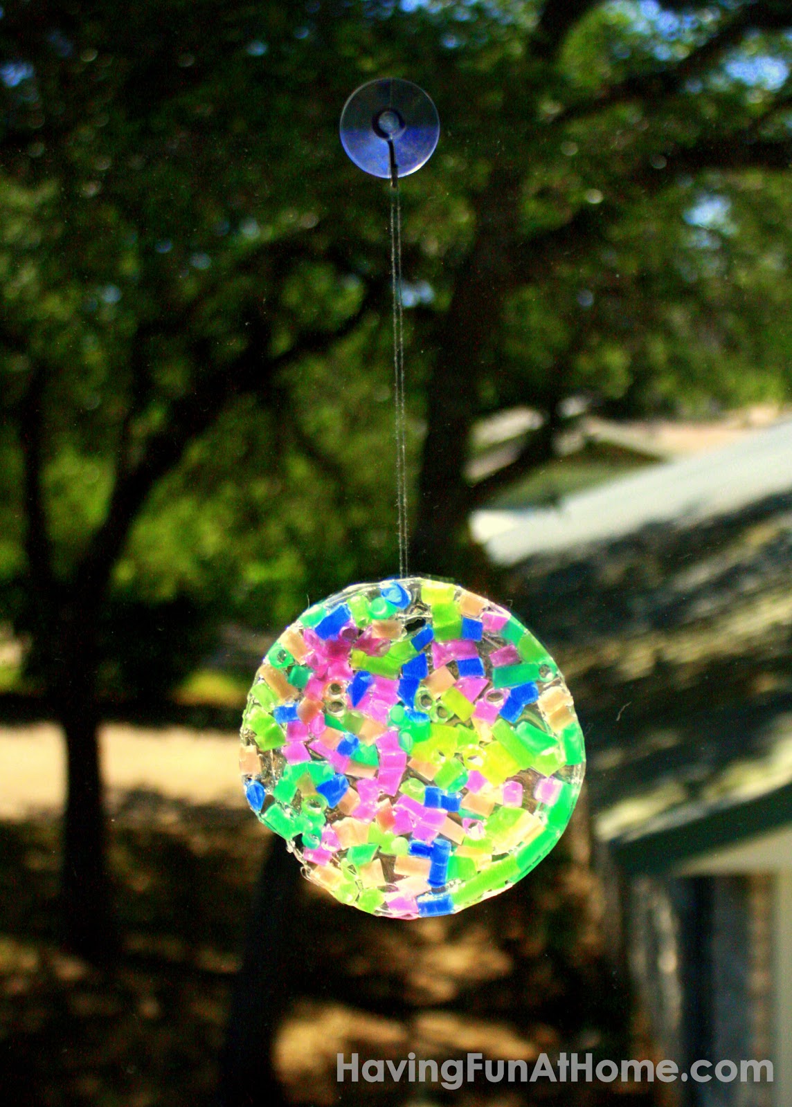 Sun Catcher Fill the yogurt lid with the clear Elmer's glue, before placing  the gems inside and pouring a bit …