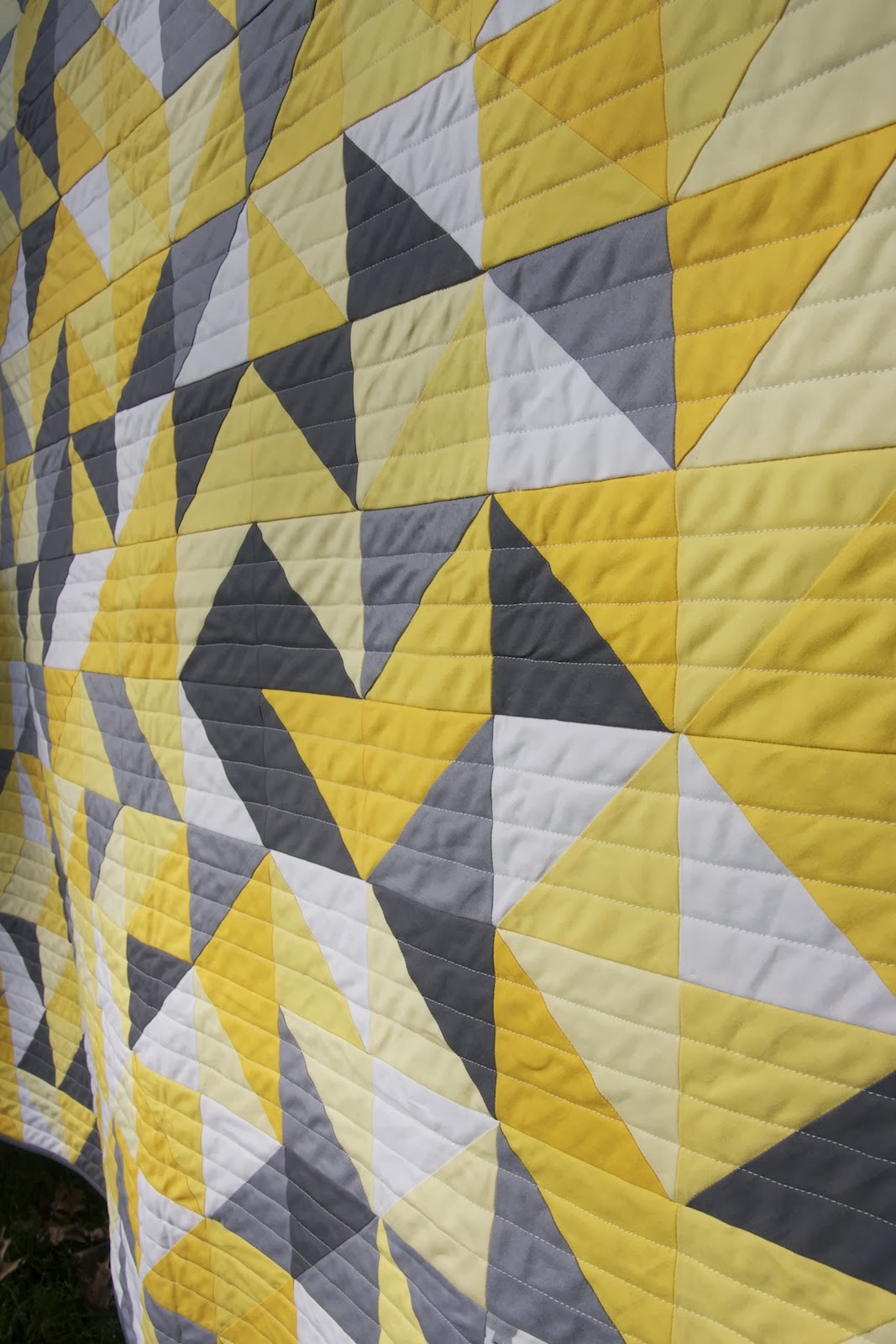 Momotaro Makes Gray, Yellow, and White Baby Quilt