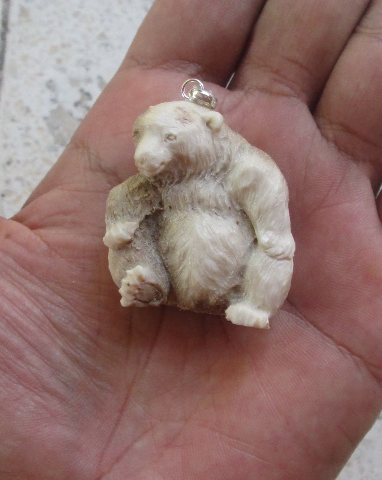 Carved Bear Bone Pendants in Antler Carved Bear Bone Pendants in Antler