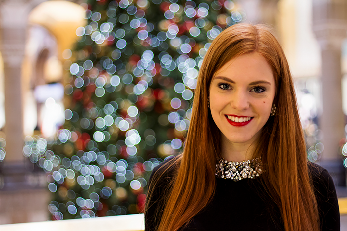 Fashion Blogger Christmas Outfit with a black and gold midi skirt and statement necklace