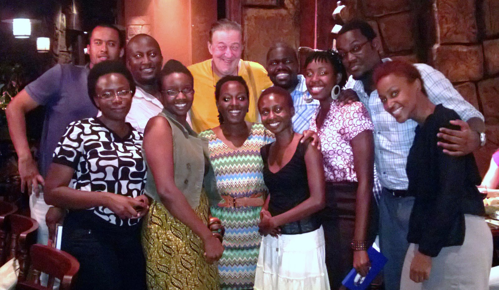 http://4.bp.blogspot.com/-dRIgGf4XnhI/USPgBiQ7ogI/AAAAAAAAIRM/wkaRCcypmvY/s1600/stephen+fry+with+ugandans.jpg