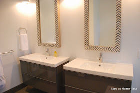 Herringbone vanity mirrors over Ikea vanities