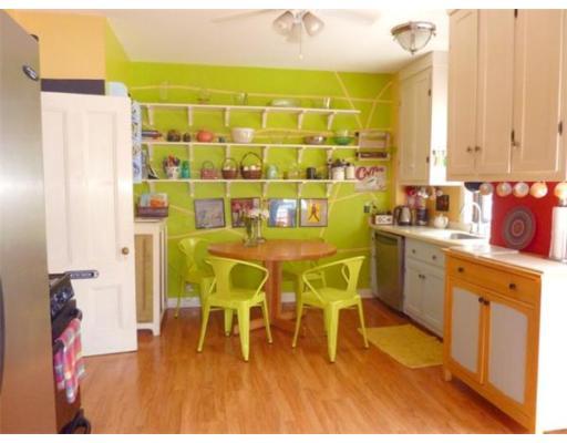Green Kitchen with Red Accent Wall