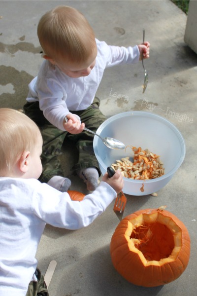Carving pumpkins with toddlers - fall sensory play
