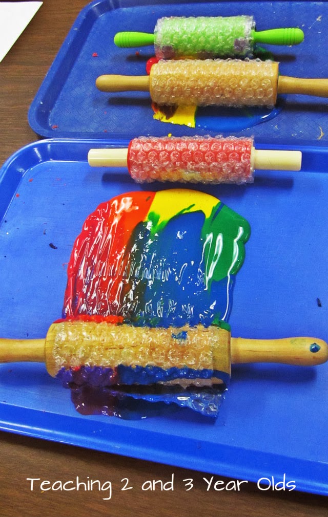 Preschool Painting with Rolling Pins Teaching 2 and 3 year olds