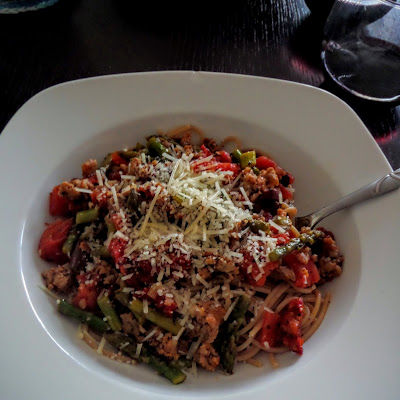 Sun-dried Tomato Olive and Asparagus Pasta:  Sun-dried tomatoes, olives, asparagus and Italian sausage in a chunky pasta sauce served over whole wheat pasta and topped with parmesan.