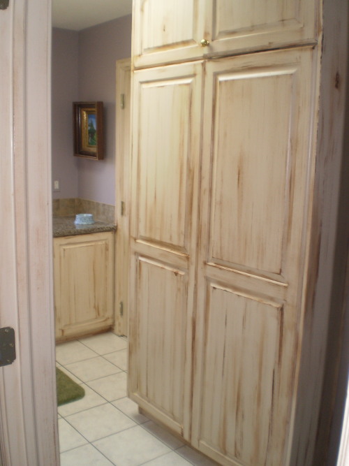 of cabinets and and doors that were previously a dated white wash of cabinets and and doors that were previously a dated white wash