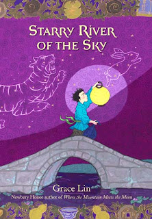 Sweet cover of new Grace Lin book: Starry River on the Sky Young which has a boy holding a lantern crossing a stone bridge. The purple sky is filled with tiger and rabbit constellations
