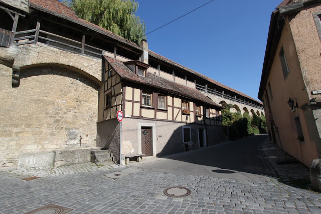 The city wall is surrounded the city of Rothenburg in Germany The city wall is surrounded the city of Rothenburg in Germany