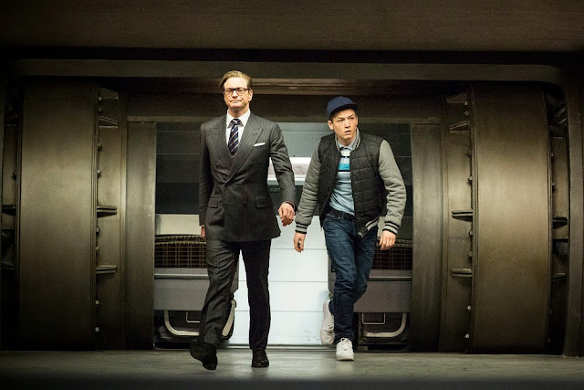 Colin Firth as Harry Hart and Taron Egerton as Eggsy in Kingsman: The Secret Service. colin firth taron egerton kingsman still